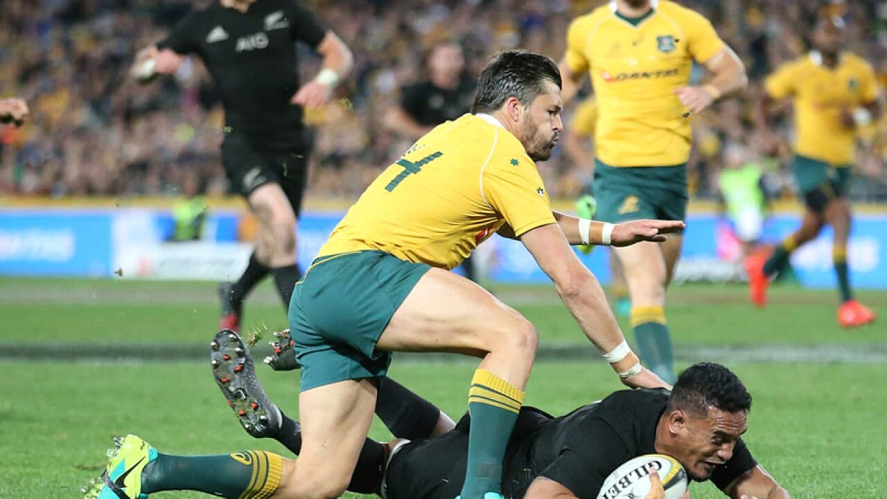 New Zealand's Jerome Kaino scores a try
