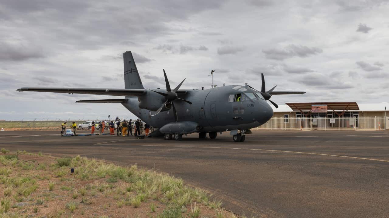A Royal Australian aircraft on the taxiway of Coober Pedy, delivering food to the region.