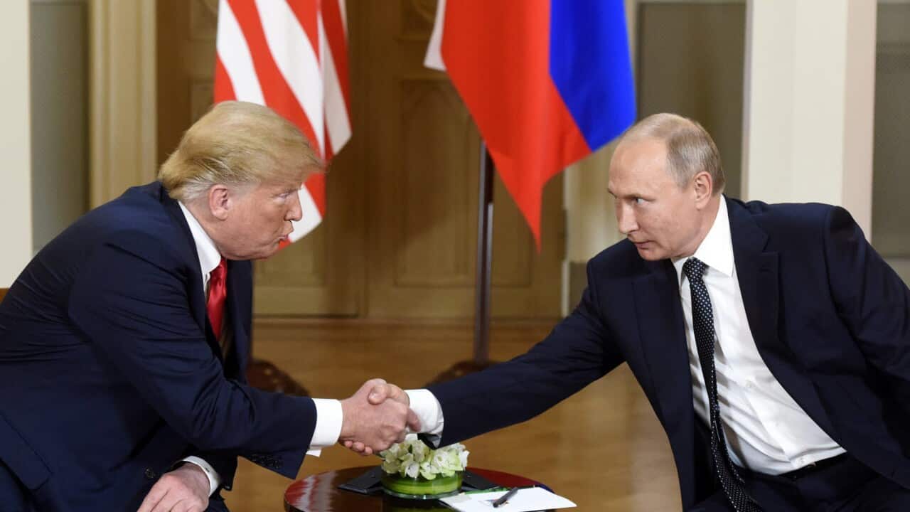 President Donald Trump and Russian President Vladimir Putin shake hands during their meeting.