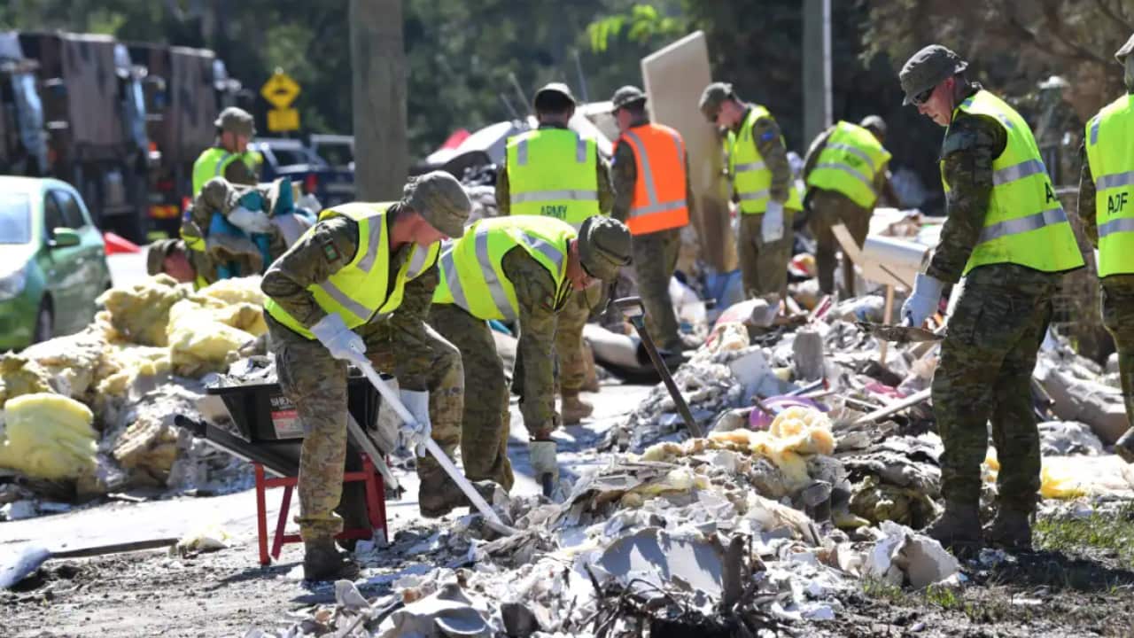 Members of the Australian Defence Force are seen helping in the clean up of flood-affected properties in the suburb of Goodna in Ipswich, Queensland on Tuesday, 8 March, 2022.
