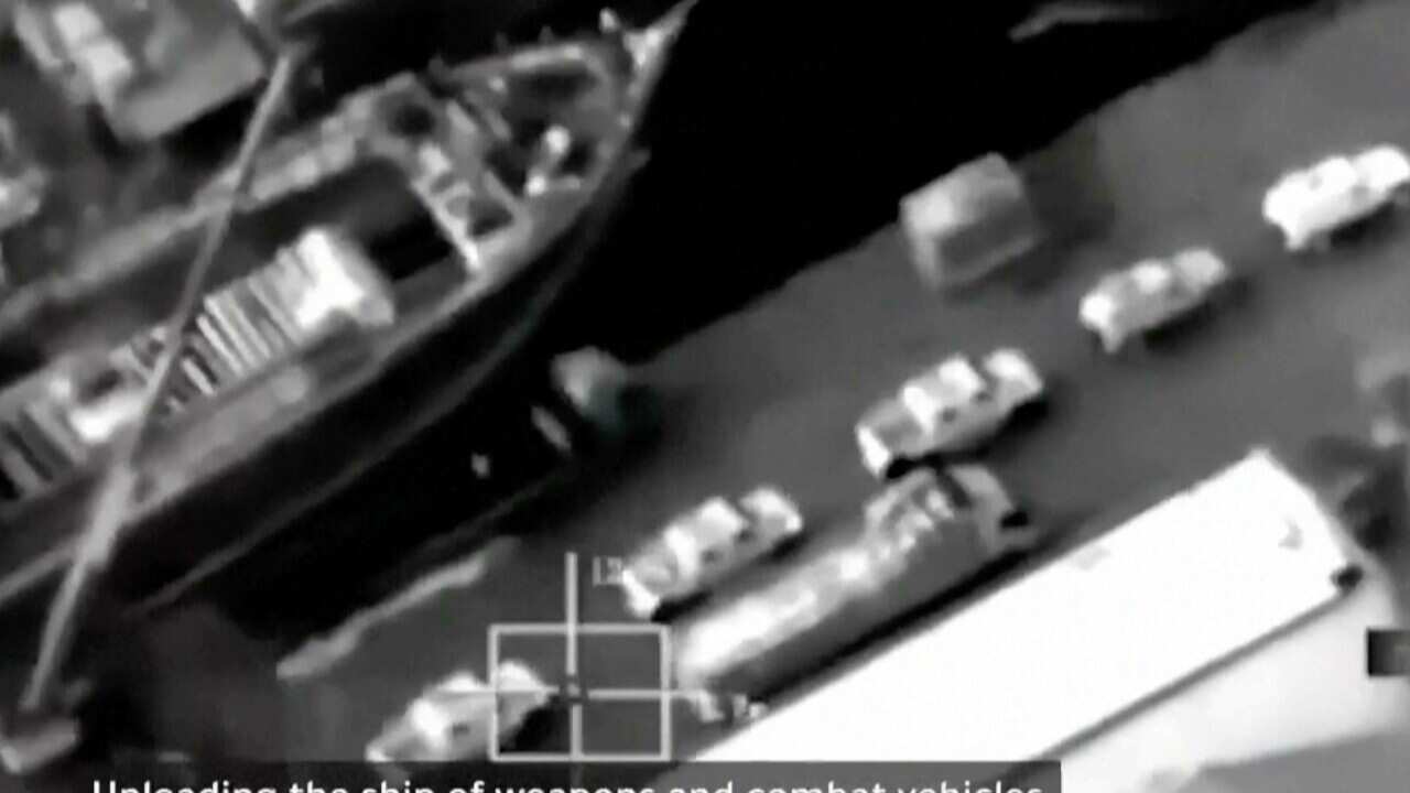 A frame grab from a video shows a ship at a port.