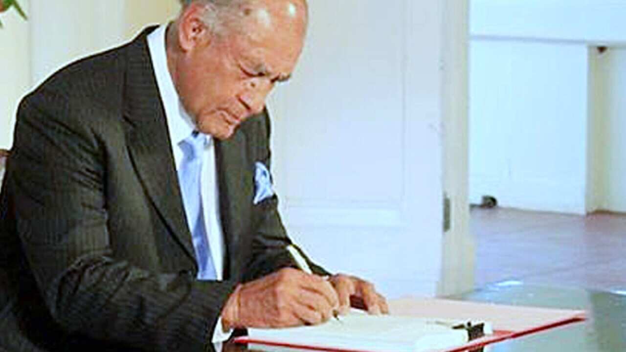 Fiji's President Ratu Epeli Nailatikau signs the constitution