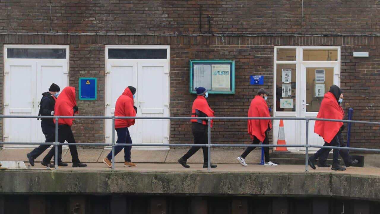 A group of people thought to be migrants are brought in to Dover, Kent, by UK Border Force officers.
