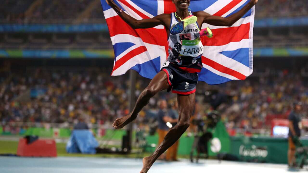 Great Britain's Mo Farah celebrates winning the Men's 5000m final