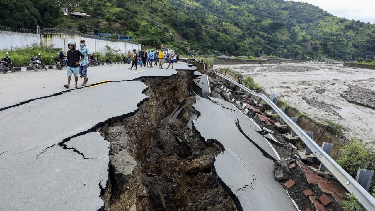 A damaged road in the aftermath of floods in Dili, East Timor, also known as Timor Leste