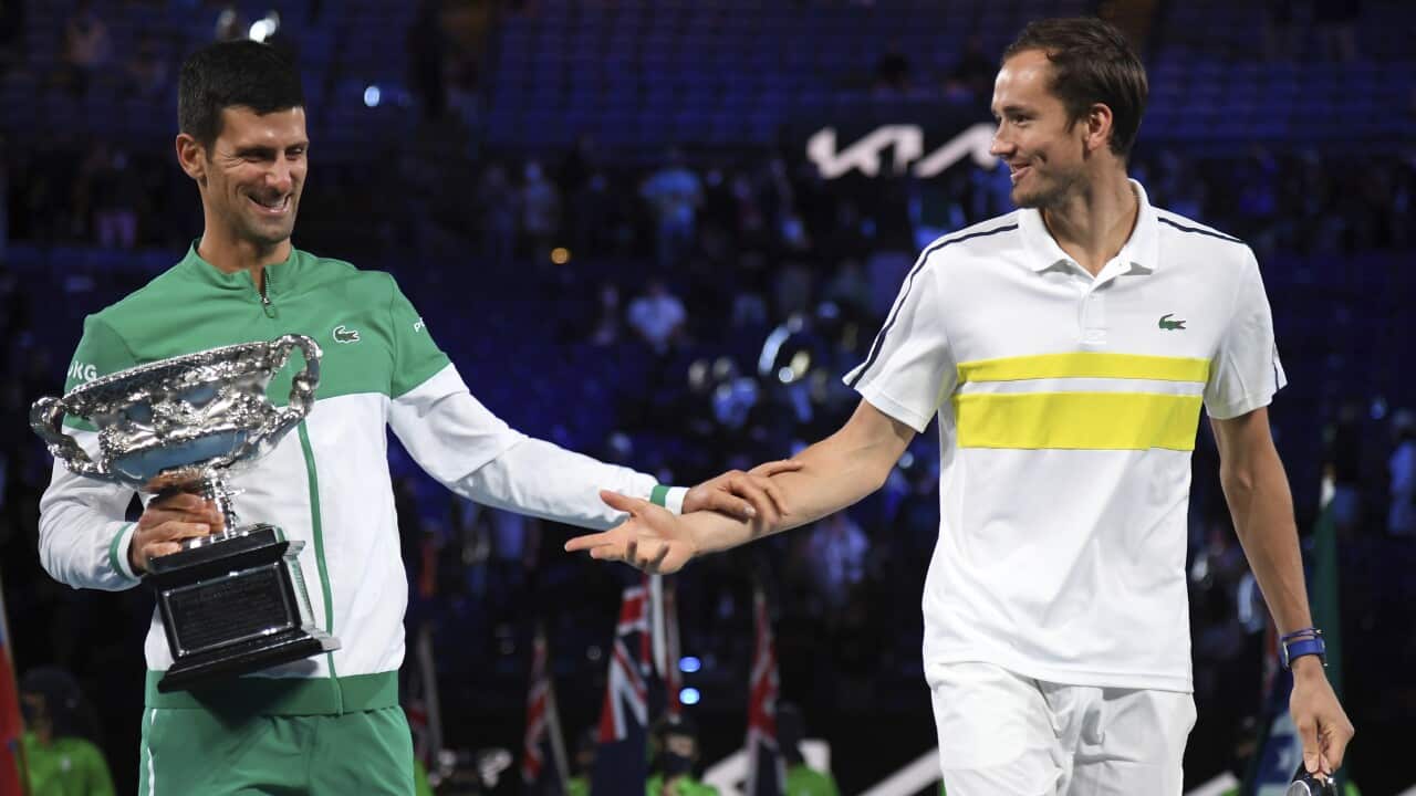 Serbia's Novak Djokovic and Russia's Daniil Medvedev after the Australian Open finals in Melbourne 2021.