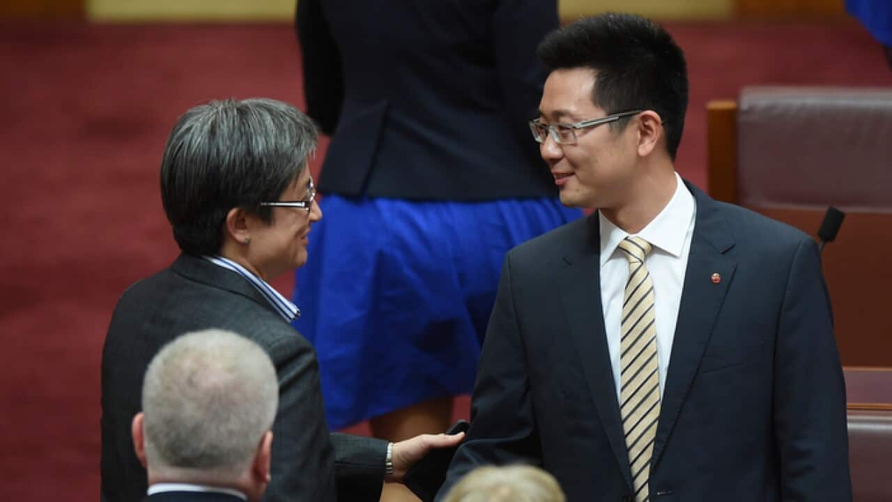 senator_dio_wang_r_is_congratulated_by_penny_wong_after_his_maiden_speech_in_the_senate_aap_larger.jpg