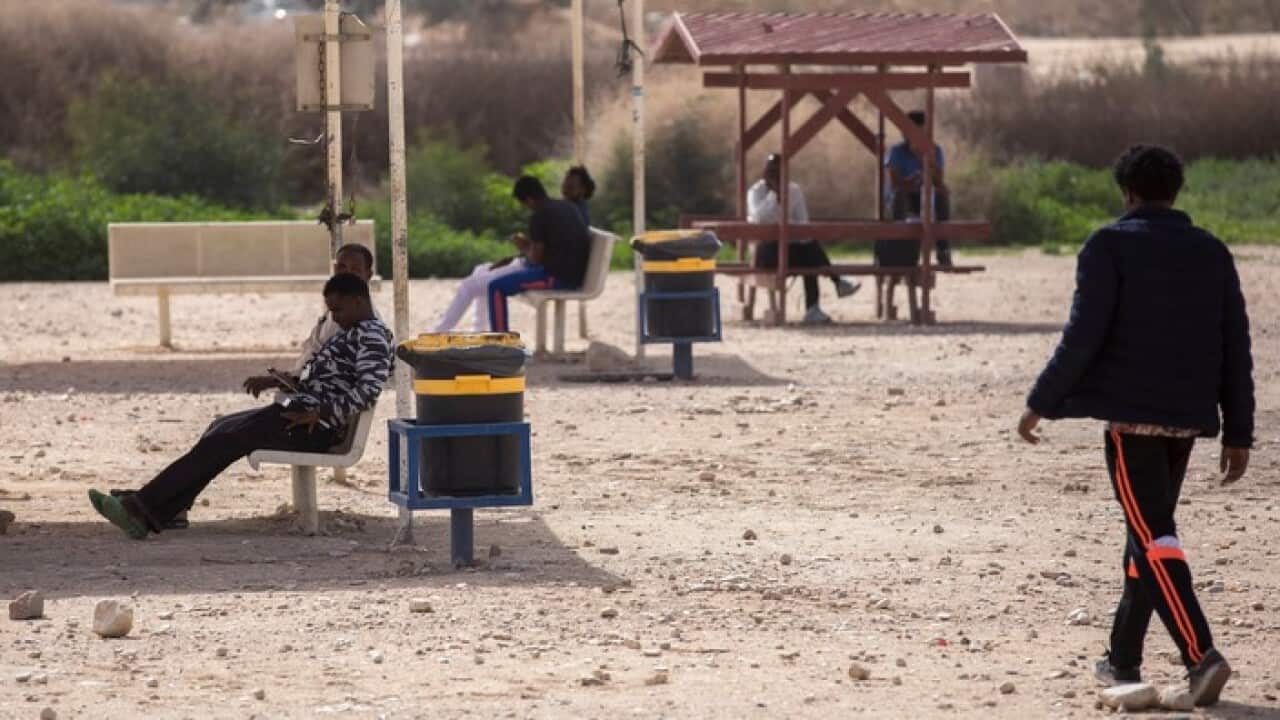 Asylum seekers outside an Israeli detention centre