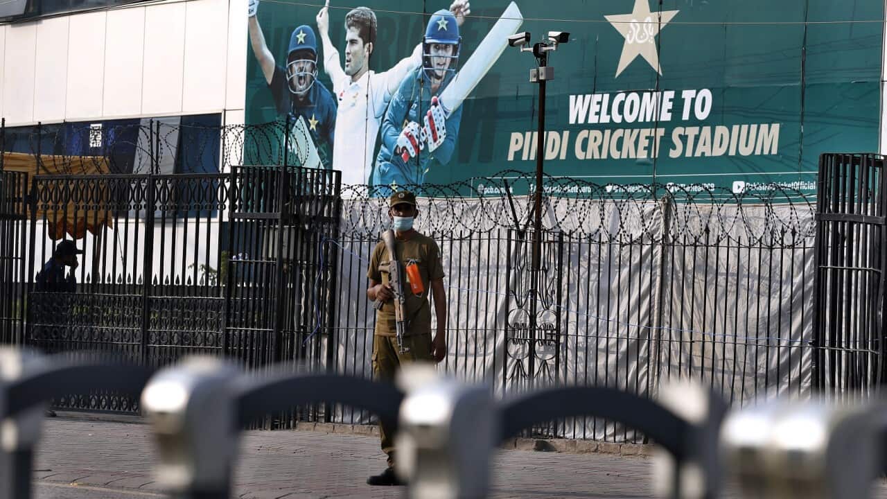 A police officer stands guard outside the Pindi Cricket Stadium, Pakistan