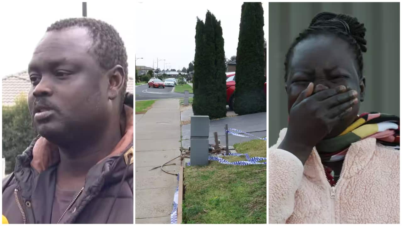 Devastated father Dau Akueng and family friend, Aboil Alor, react at the scene of a fatal youth stabbing in Cobblebank, Melbourne.