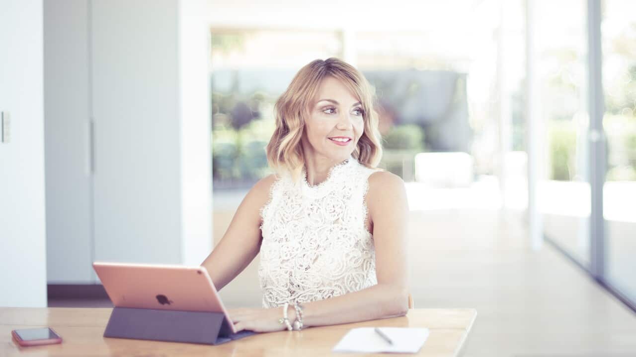 a woman sitting at a computer