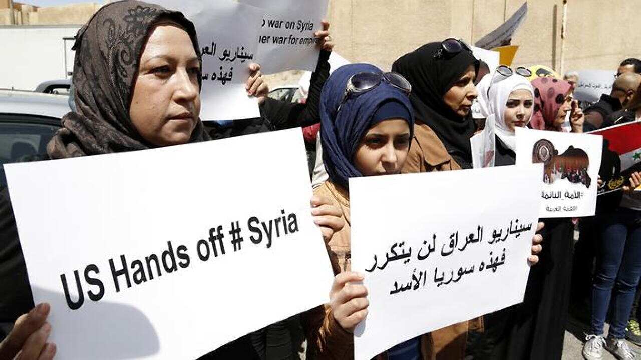 Dozens of Syrians gathered outside the offices of the United States in Damascus, Syria to protest against the US cruise missile attack