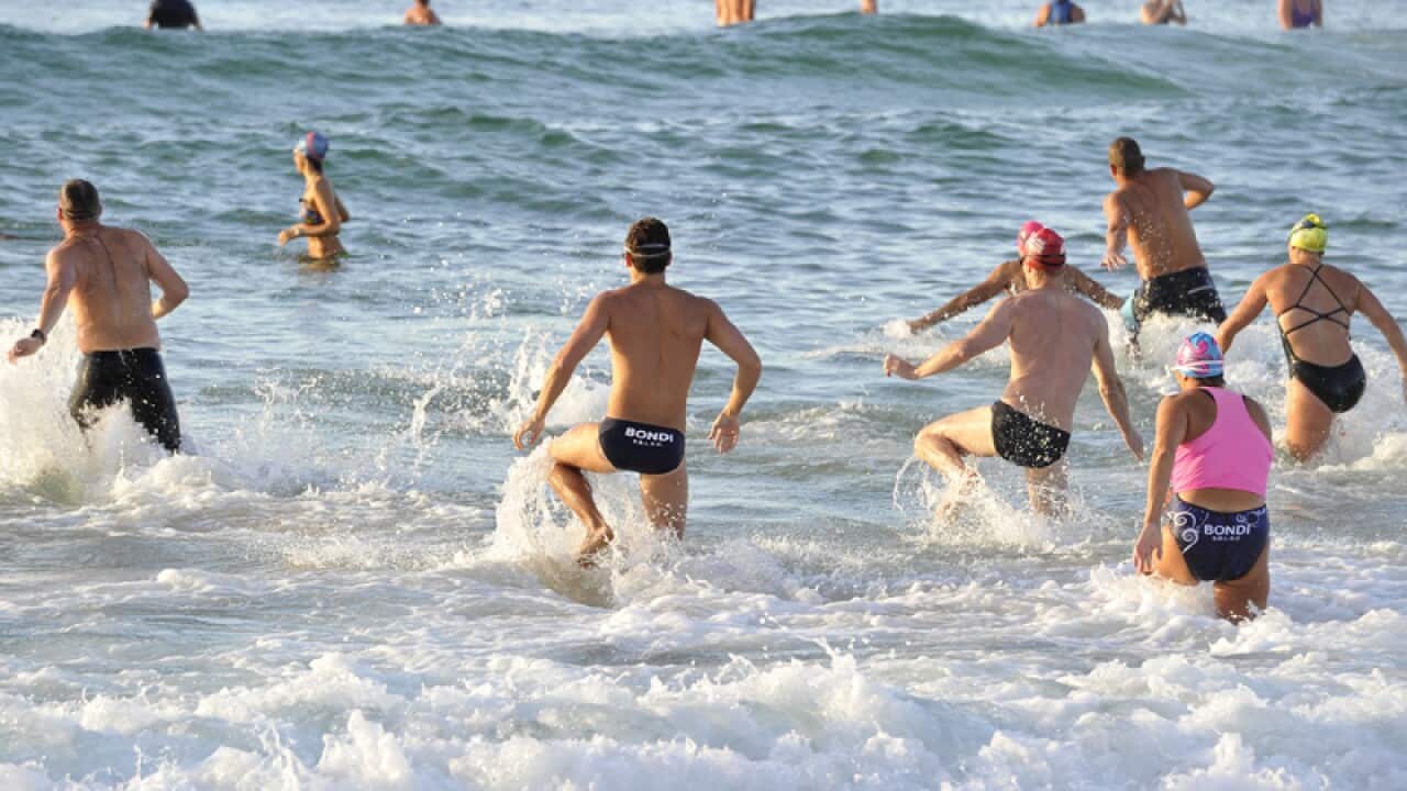 People enjoy the water at Bondi Beach
