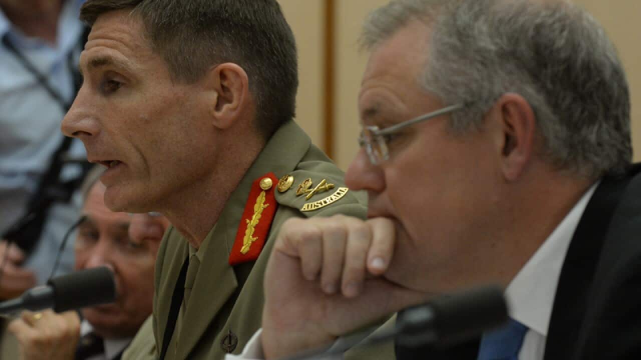 General Angus Campbell (L) and Immigration Minister Scott Morrison