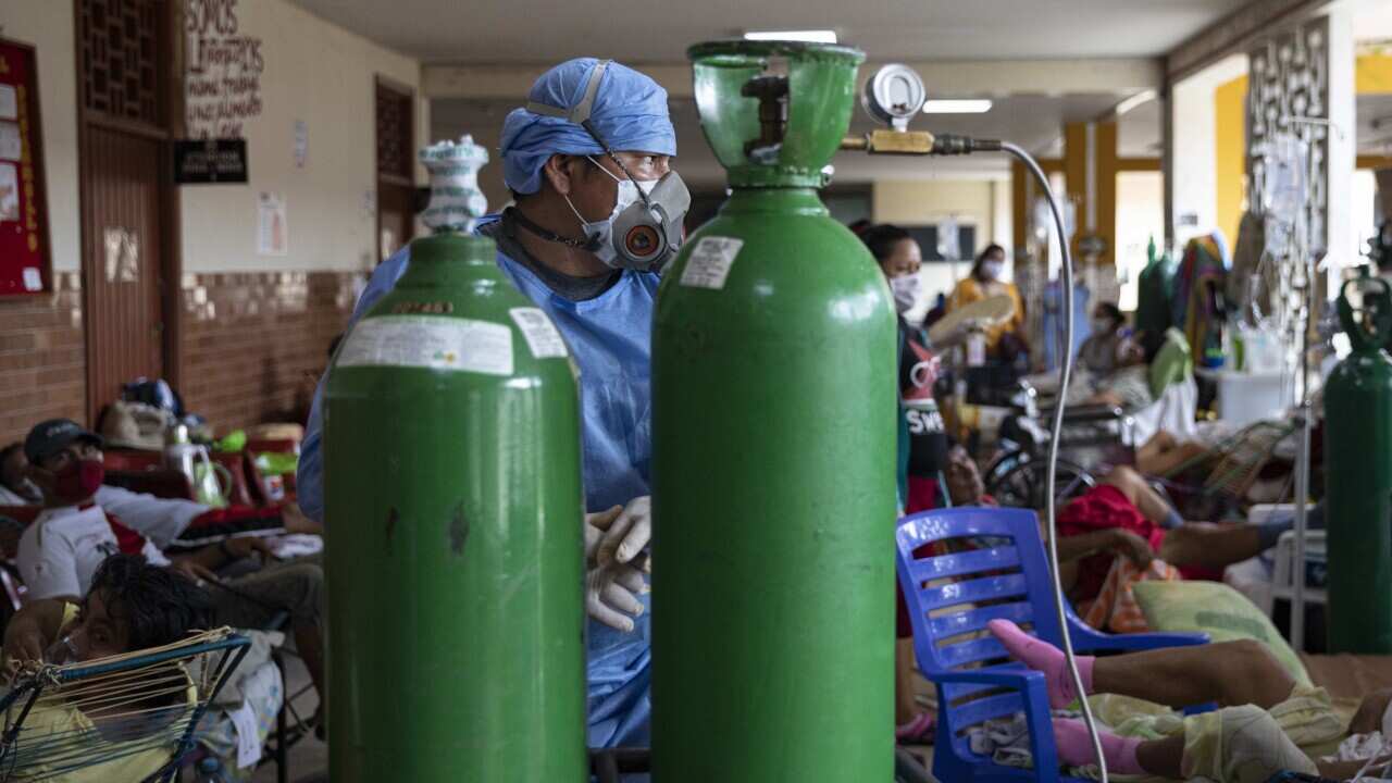 A doctor in a biosafety suit checks a room with COVID-19 patients at the Regional Hospital of Iquitos, in Iquitos, Peru, 07 May 2020