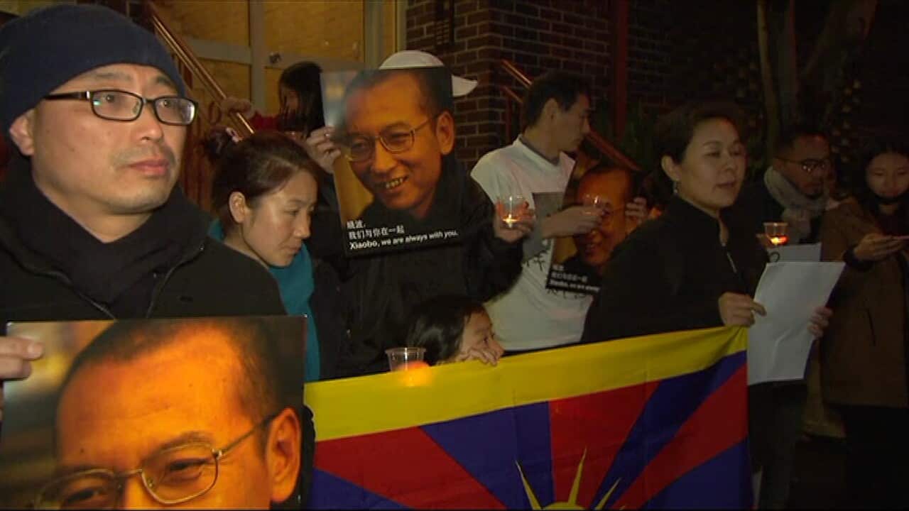 Activists attend a candlelight vigil in Sydney.