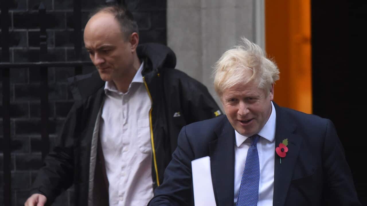 Prime Minister Boris Johnson and his political advisor Dominic Cummings leave 10 Downing Street.