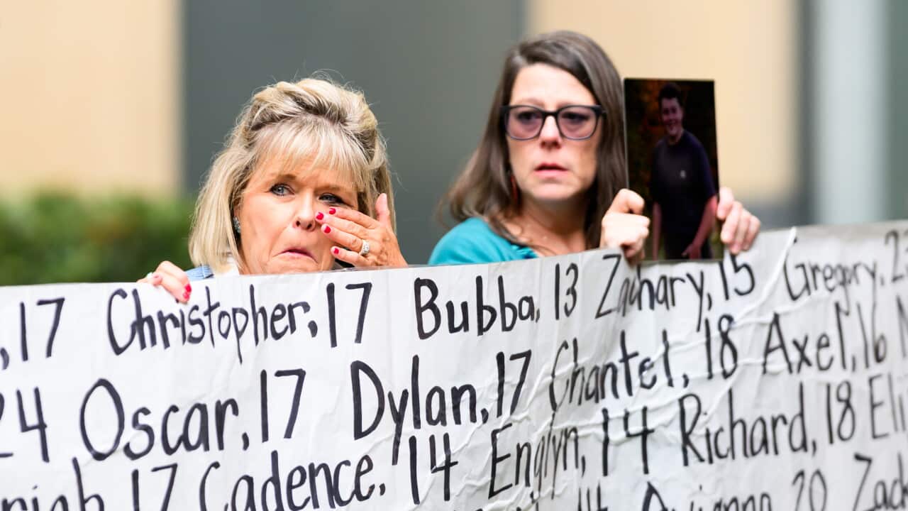Lori Schott, whose daughter Annalee Schott died at age 18, holds a banner with names of young people who advocates say died as a result of social media outside the Ronald V. Dellums Federal Building and U.S. Courthouse on Tuesday, Aug. 18, 2026, in Oakland, Calif.