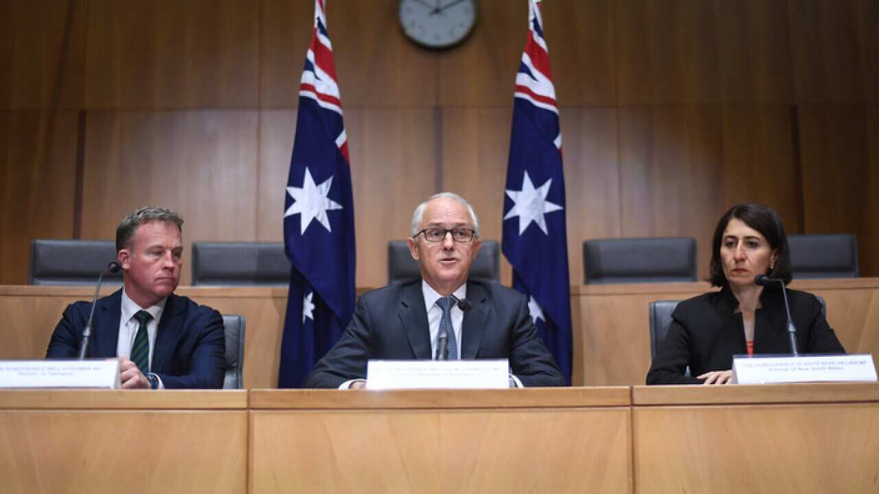 Australian Prime Minister Malcolm Turnbull, State Premiers and Chief Ministers attend a signing ceremony for a special meeting on counter-terrorism