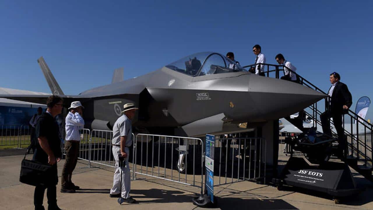 Visitors look at the F-35 Joint Strike Fighter (JSF) jet at the Avalon Airshow 2017 in Avalon, Melbourne, Tuesday, Feb. 28, 2017. (AAP Image/Tracey Nearmy) NO ARCHIVING