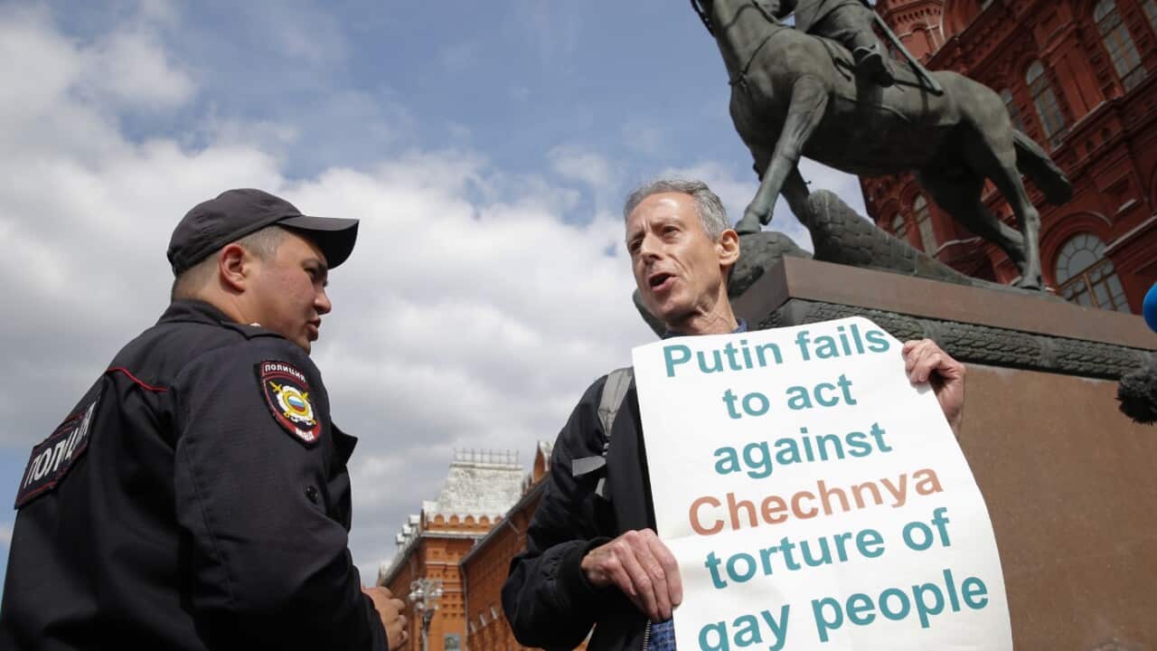 British gay rights activist Peter Tatchell stages an anti-Putin protest against the mistreatment of LGBT people in Russia in front of a monument