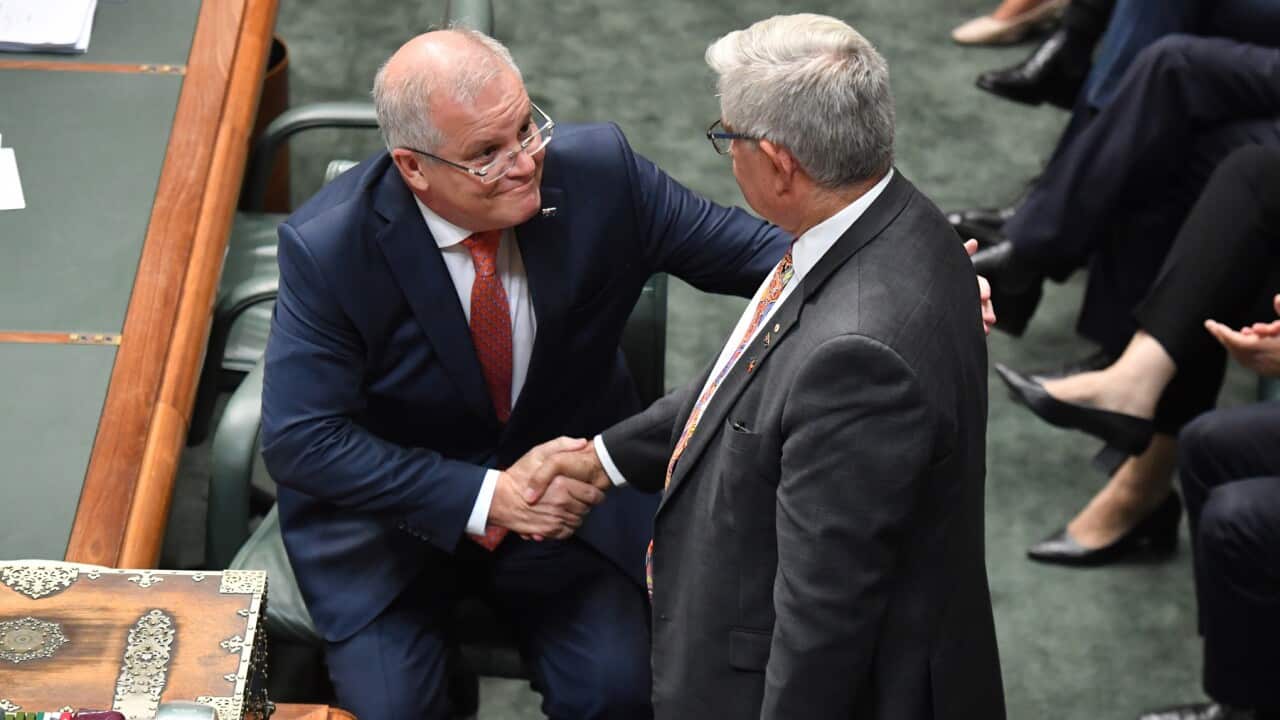 Prime Minister Scott Morrison shakes hands with Minister for Indigenous Australians Ken Wyatt