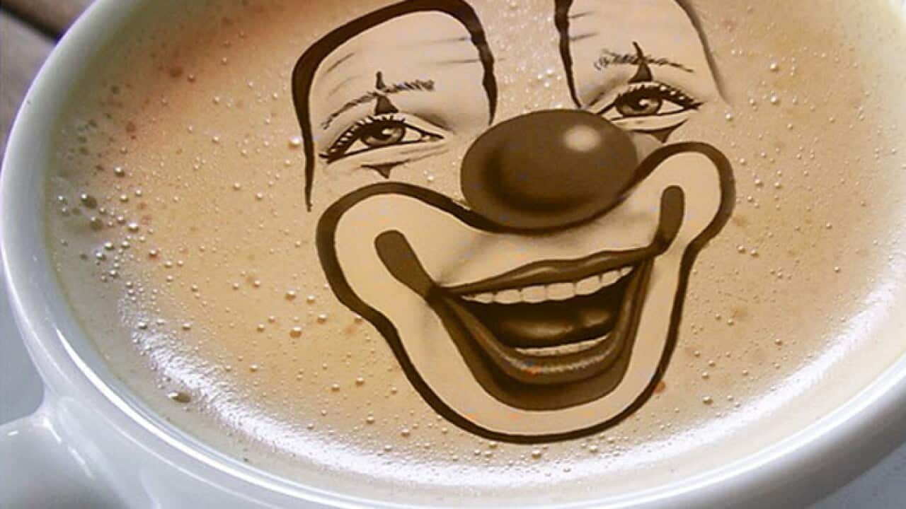 Clown smiles in a coffee cup