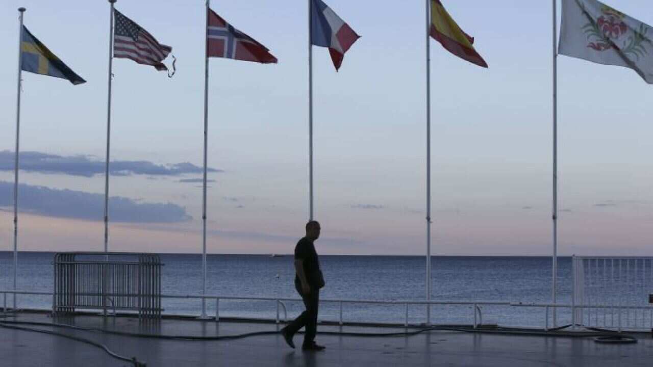 Flags near the scene of the attack in Nice, France.