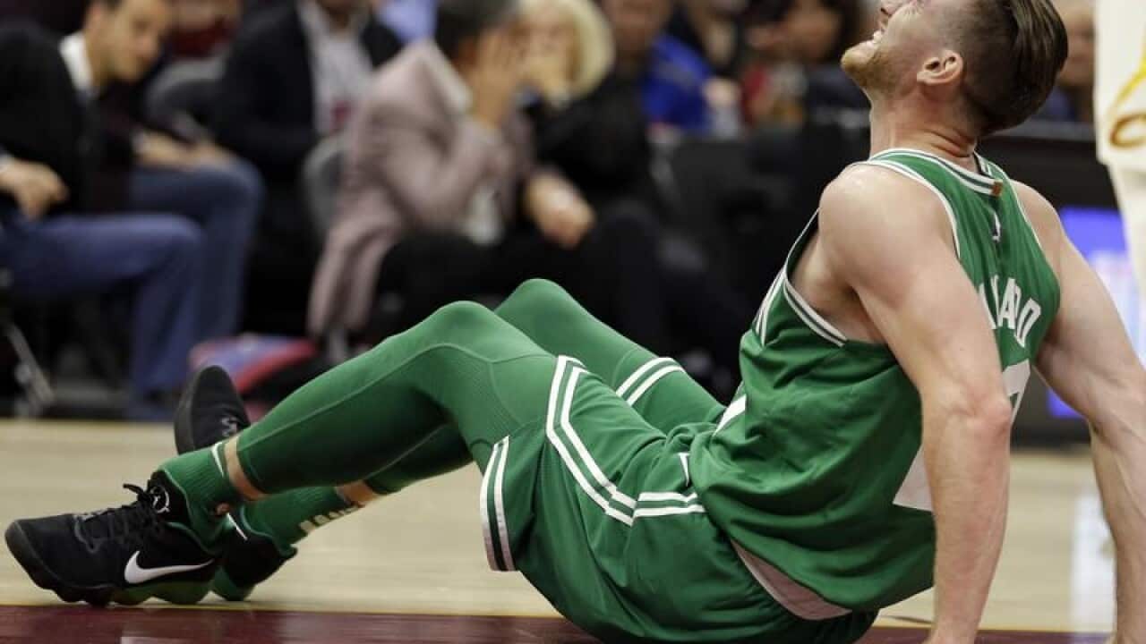 Boston Celtics' Gordon Hayward grimaces in pain.