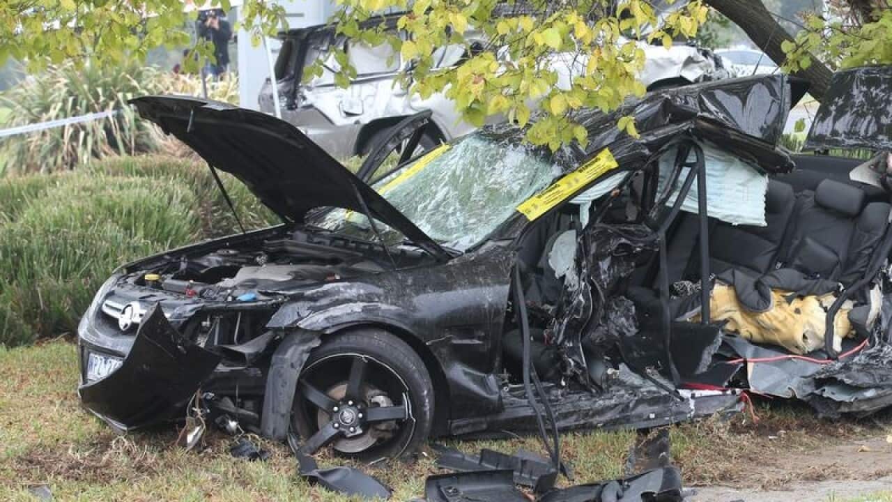 A badly wrecked black car in Melbourne