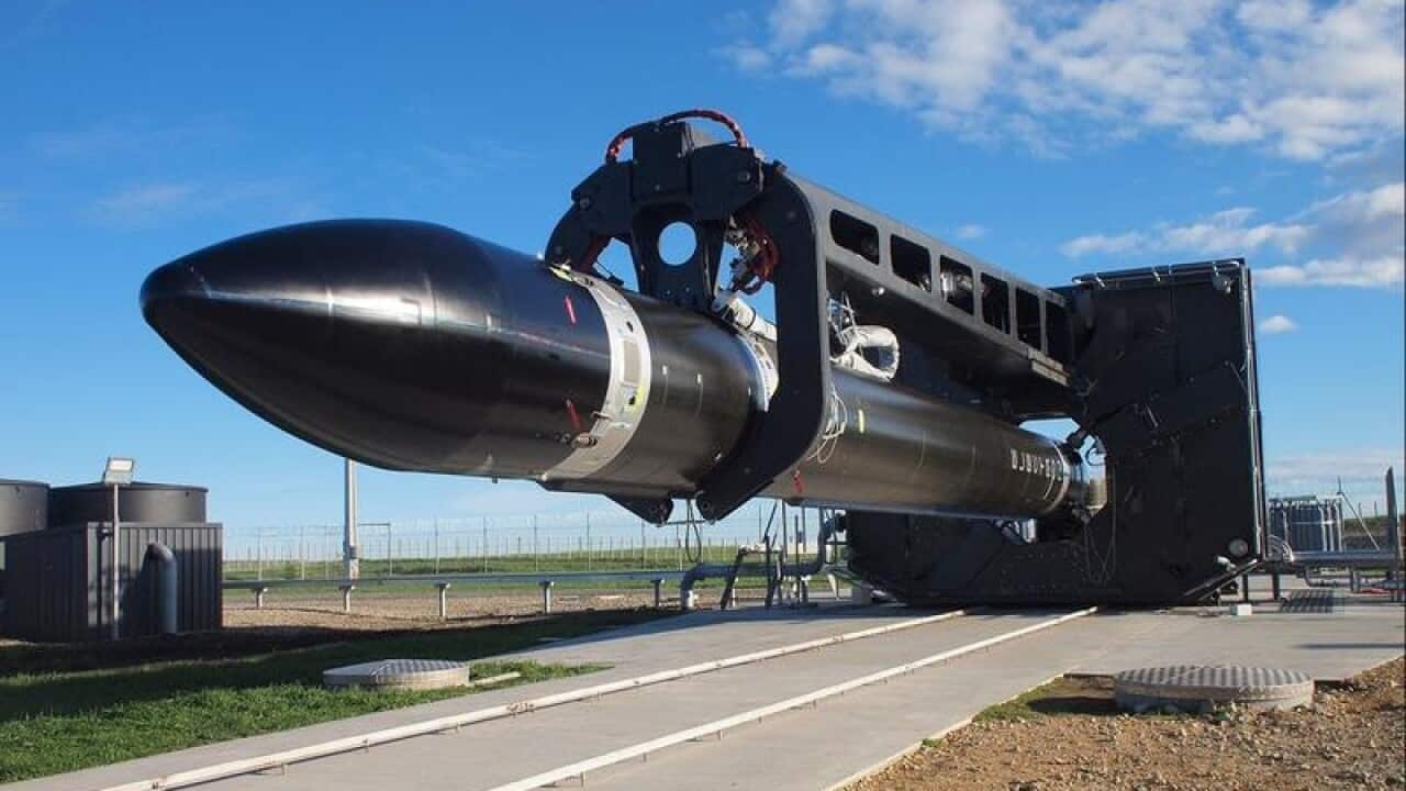 An Electron rocket being transported to a launch pad