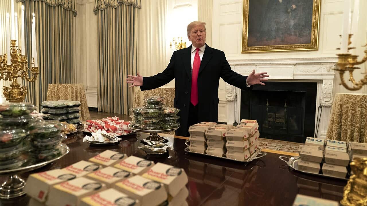 President Trump presents fast food to be served to the Clemson Tigers football team to celebrate their Championship at the White House, January 2019.