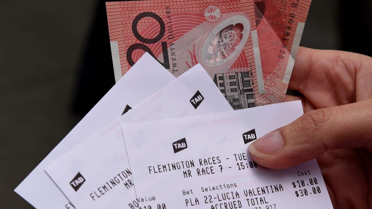A punter shows their bets for Melbourne Cup