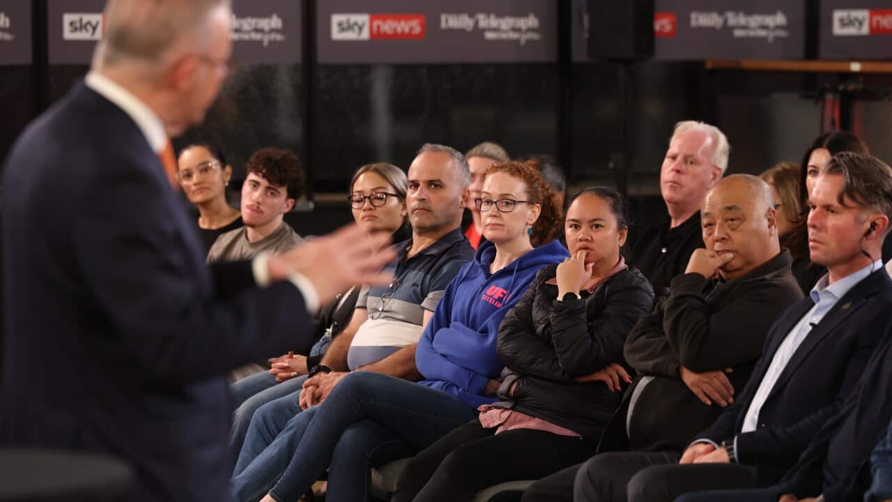 Members of the audience listen as the PM speaks.