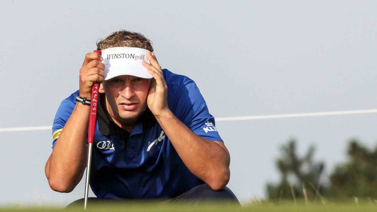 Joost Luiten looks at his putt.