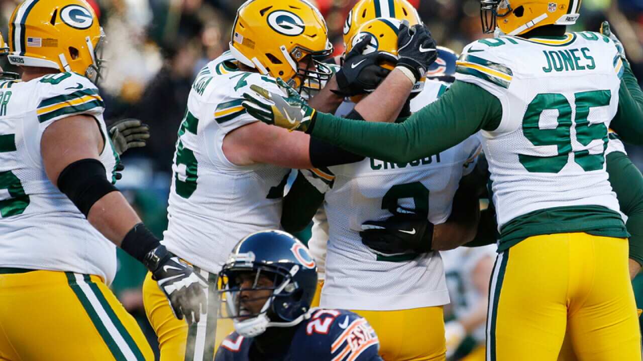 Green Bay Packers kicker Mason Crosby celebrates with his teammates