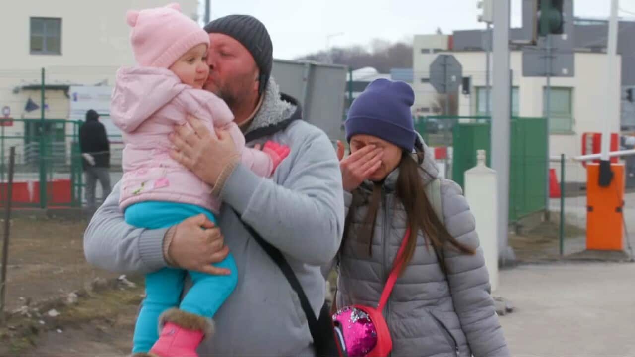 Men - who have to return to Ukraine - must leave their families at the Polish border (SBS-Ben Lewis).jpg