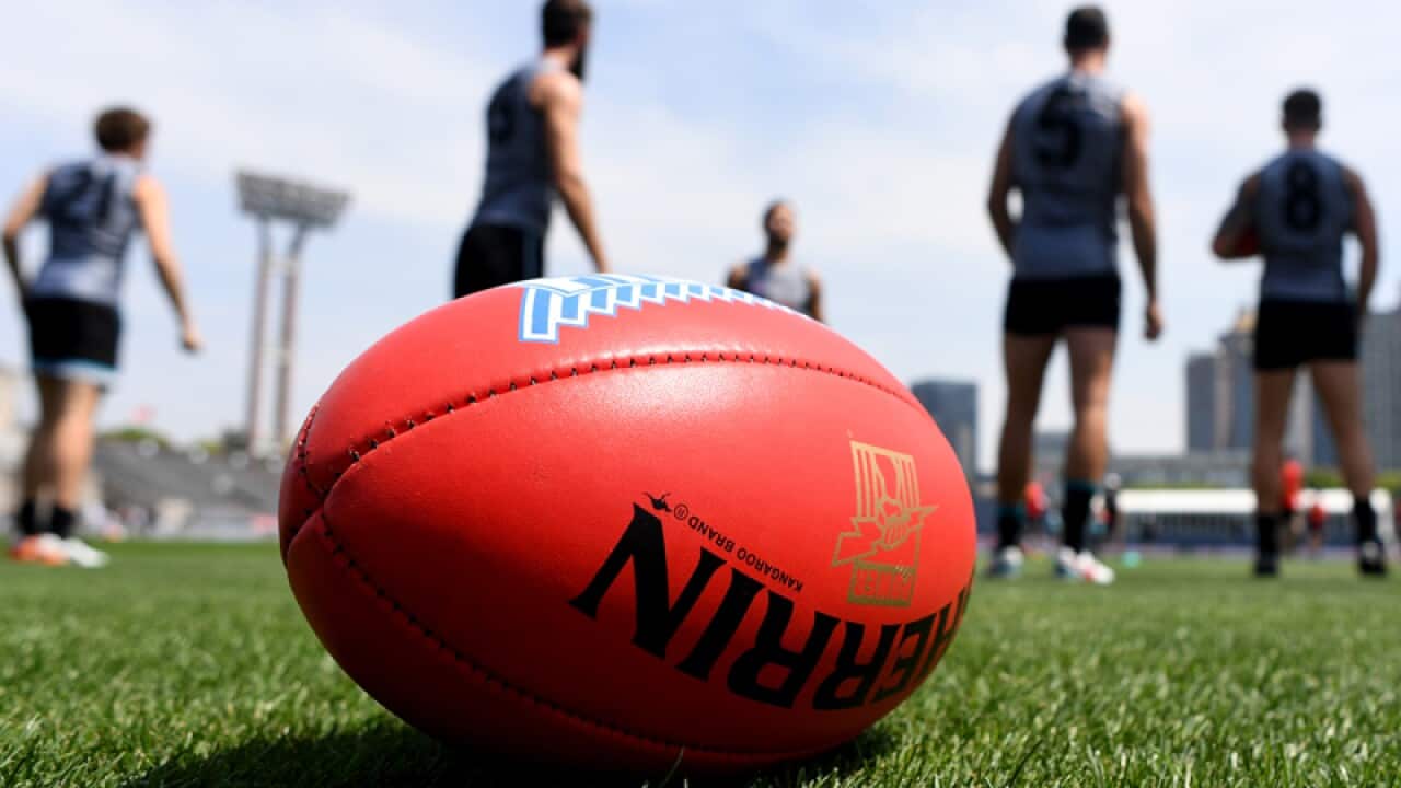 Port Adelaide Power players train at Jiangwan Stadium