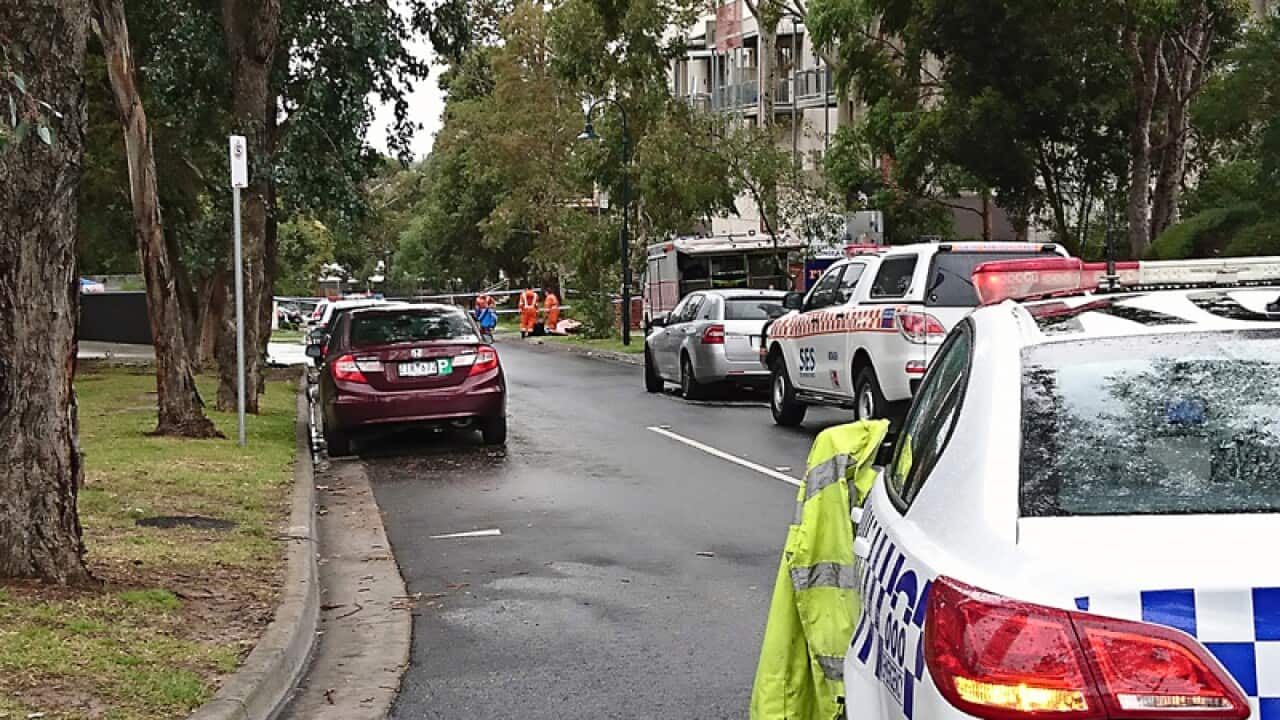 Police at the scene where a body was discovered in Melbourne
