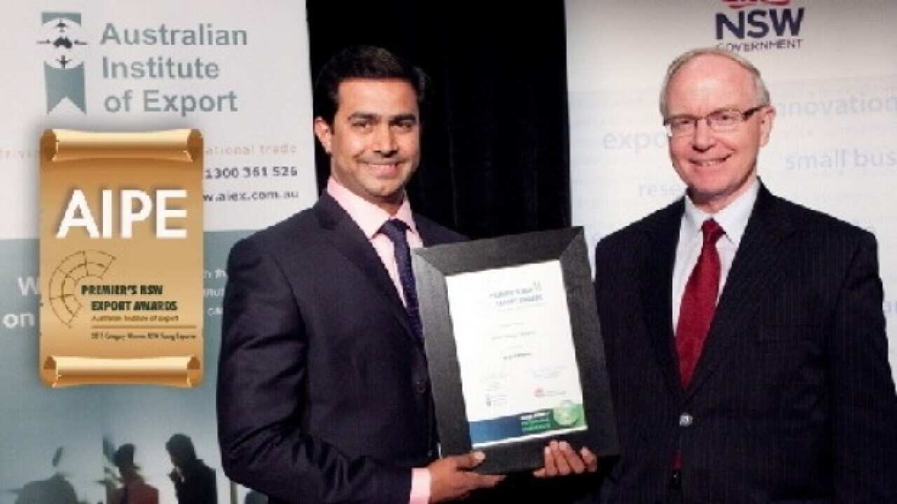 AIPE chief executive Amjad Khanche accepting an award from the NSW government.