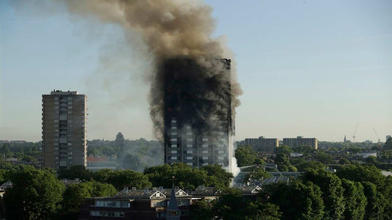 Smoke rises from Grenfell Tower.