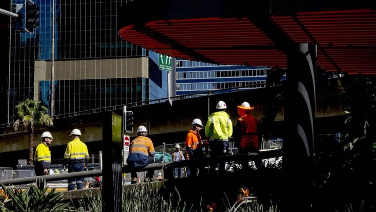 Construction workers on the Bradfield Highway off ramp.