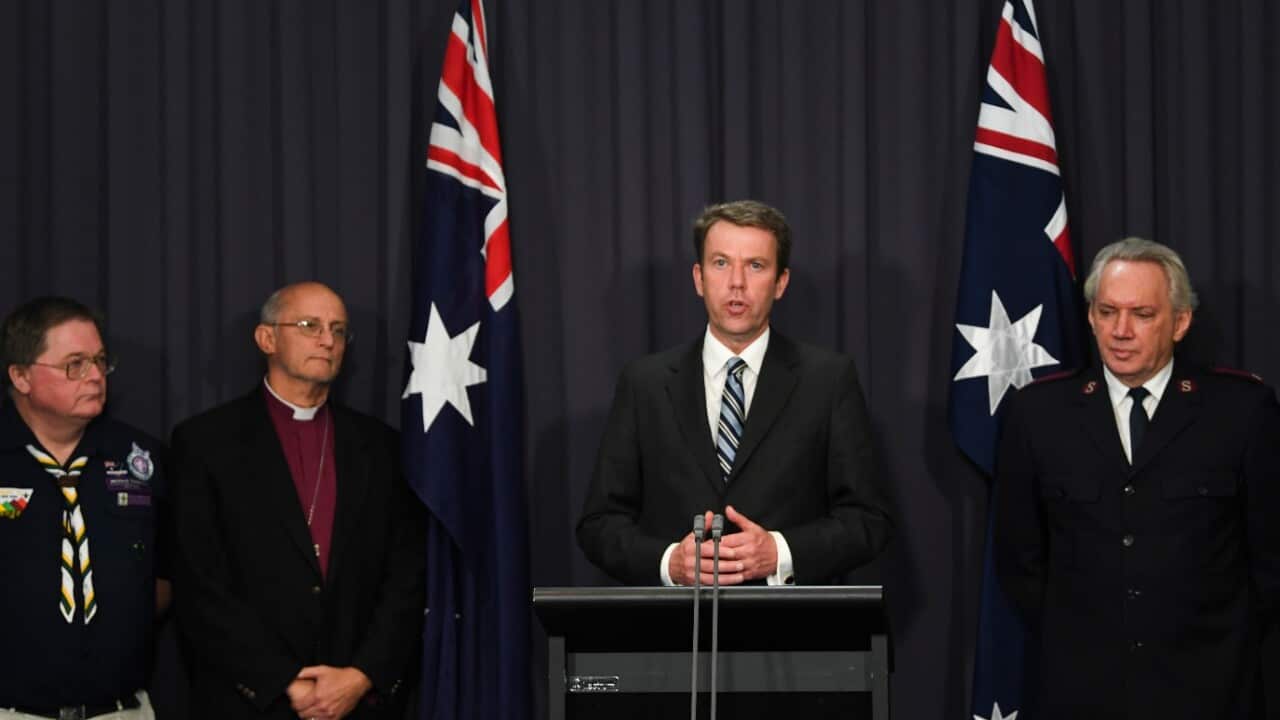 Australian Social Services Minister Dan Tehan and representatives of four non-government institutions speak during a press conference at Parliament House in Canberra