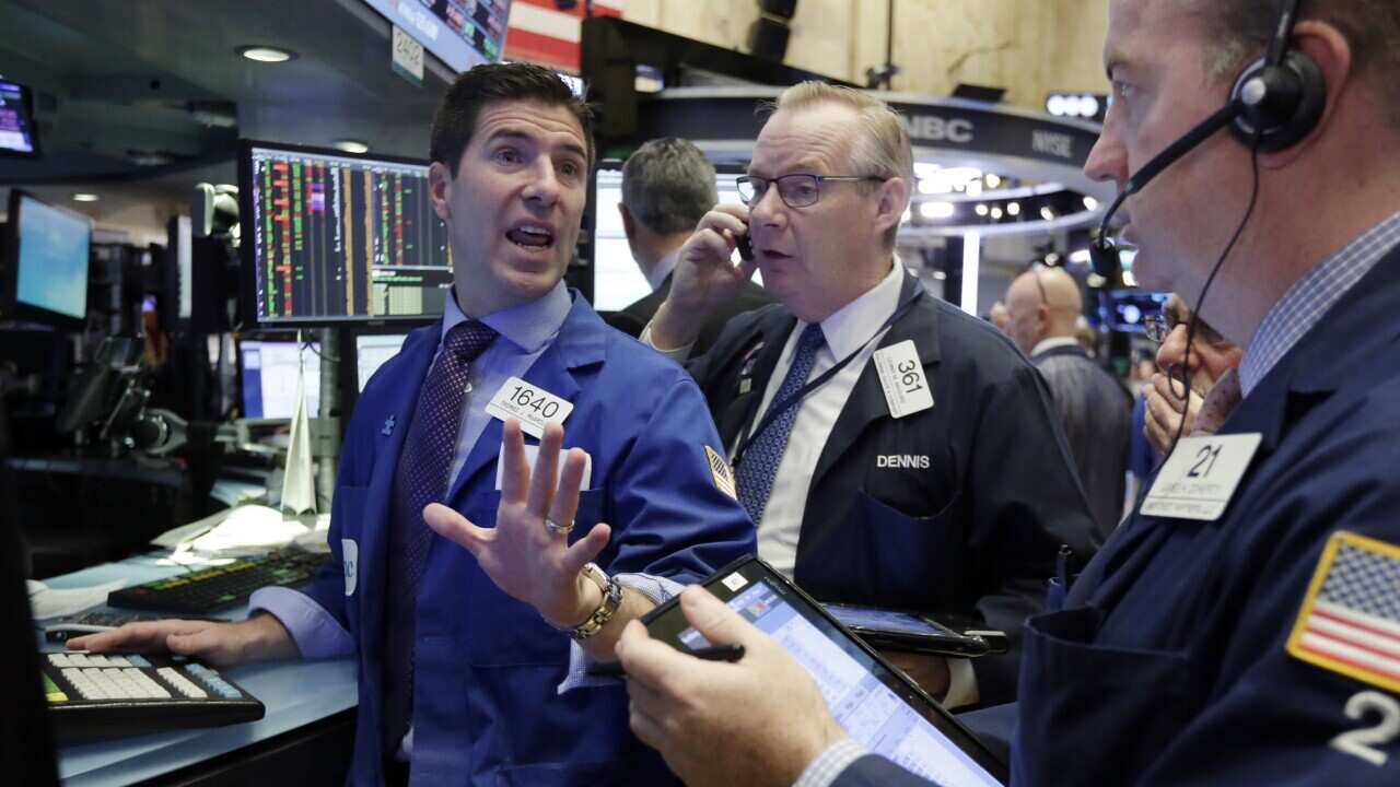 Traders on the floor of the New York Stock Exchange