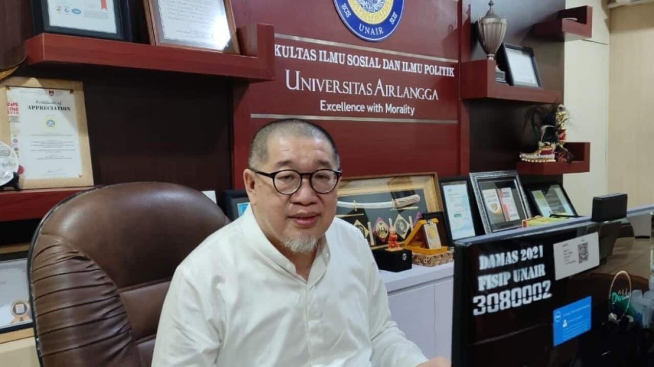 Prof Bagong Suyanto, the Dean of Social and Political Sciences at the University of Airlangga working at his office, Jul 2022. (Supplied).