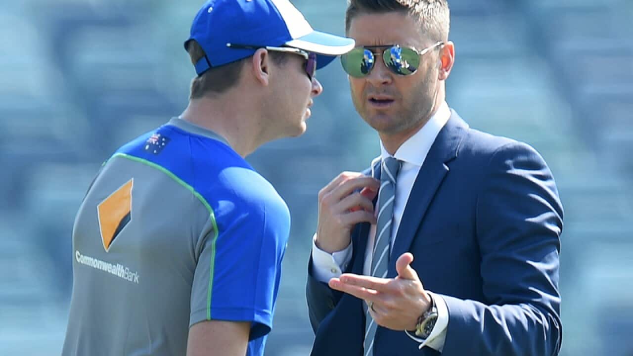 Michael Clarke (right) speaks with Australian captain Steve Smith
