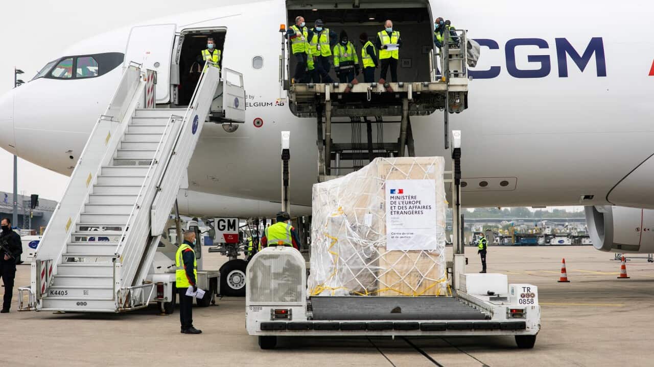 Medical supplies being loaded into a cargo plane to be sent to India, at Roissy airport, north of Paris