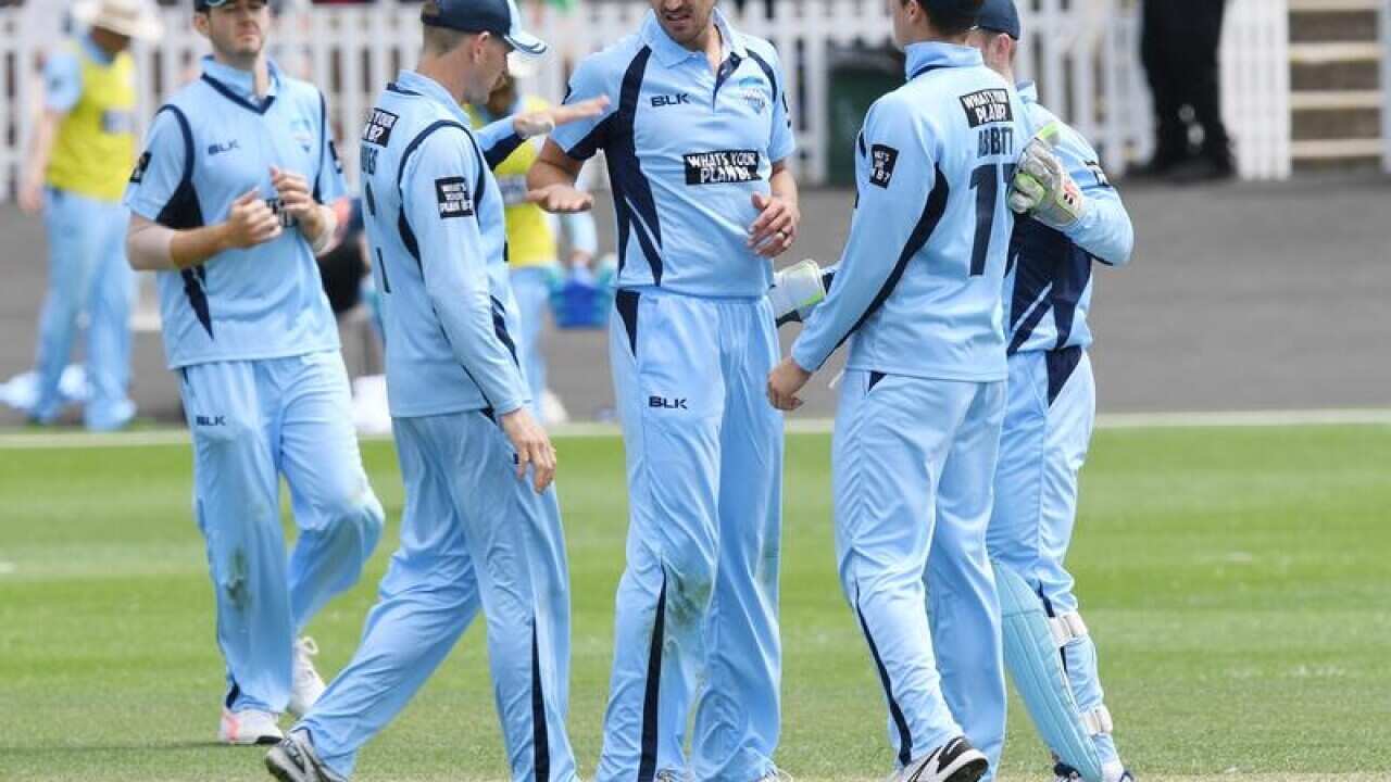 NSW's Mitchell Starc celebrates after claiming a wicket