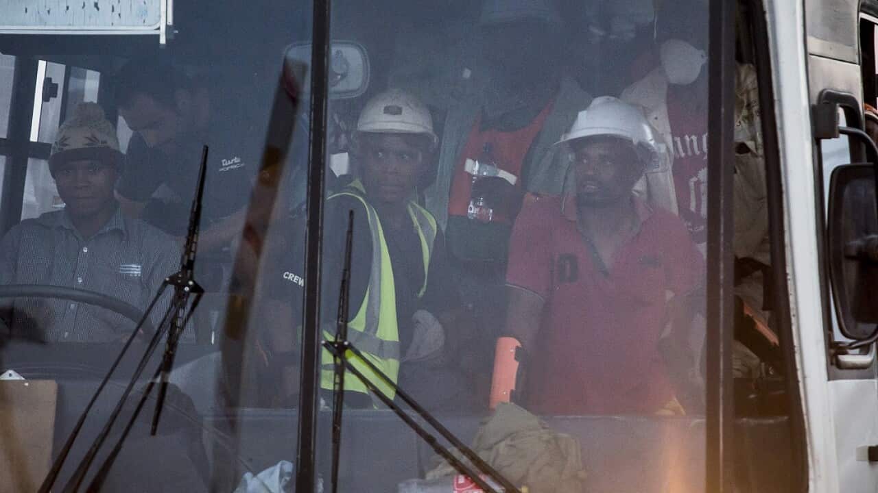 A bus, carrying some of the more than 900 rescued miners, transports them from the Sibanye-Stillwaters Beatrix mine near Welkom, South Africa.