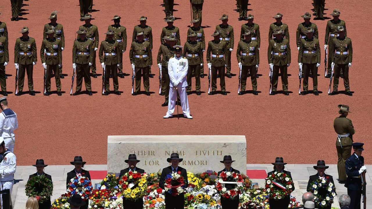 Personal messages are seen amongst the poppies on the Roll of Honour during Remembrance Day at the Australian War Memorial, in Canberra.